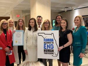 The purpose of this image is to show the group participants at the human trafficking press conference